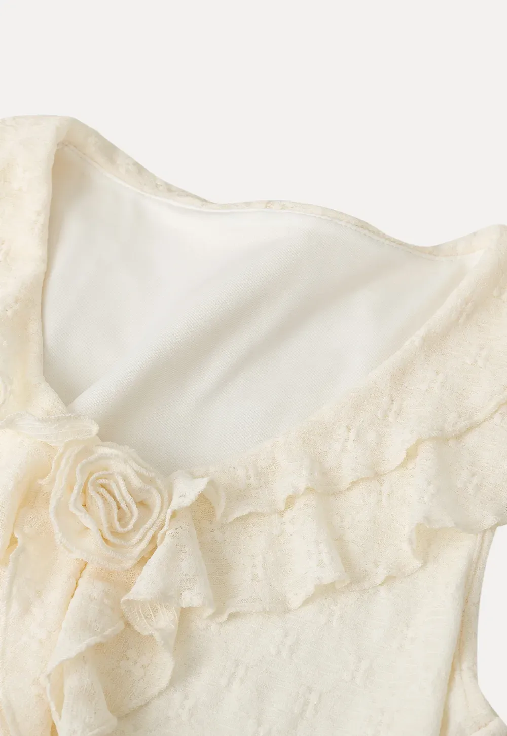 Sleeveless Top with Ruffled V Neck and Floral Detail