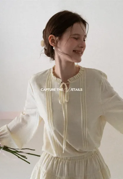 Shirt with ruffled collar and tie front layered skirt