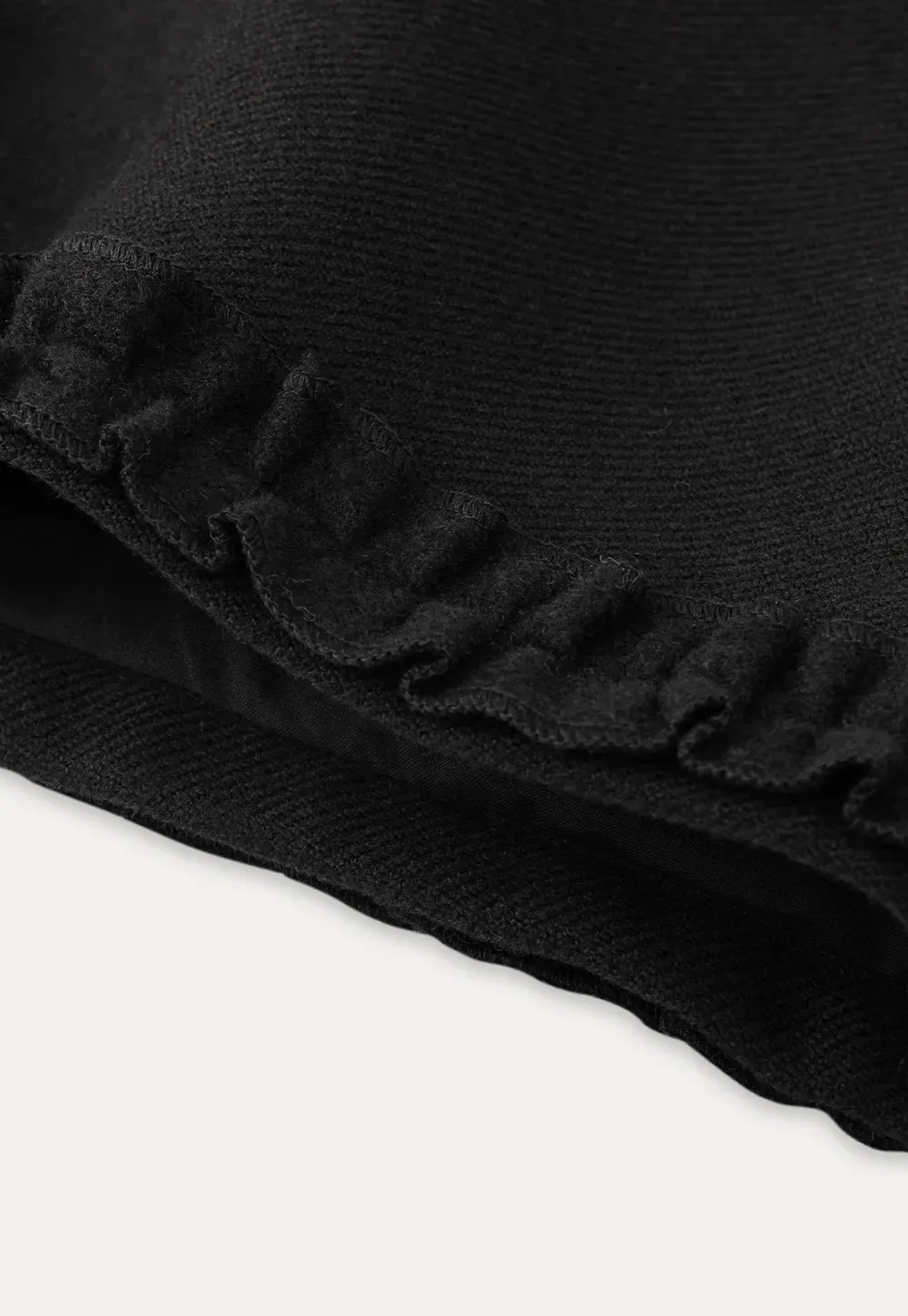 High waist shorts with ruffle hem and belt design