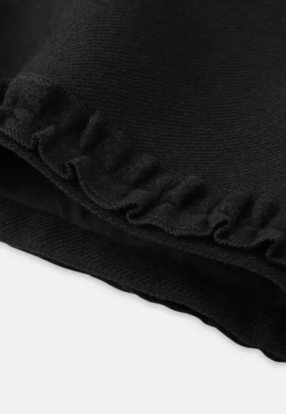 High waist shorts with ruffle hem and belt design