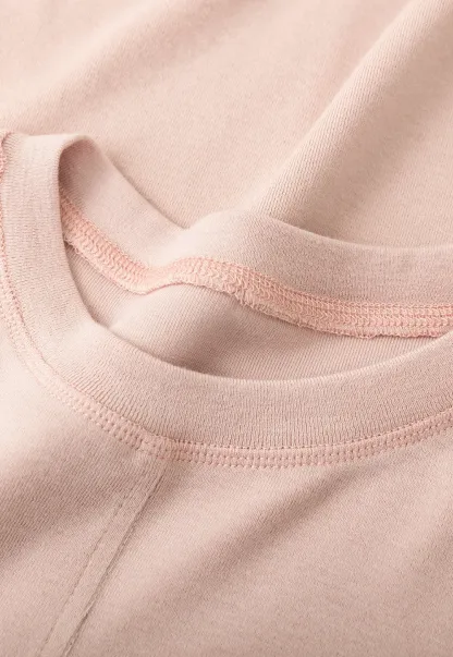 Long sleeve top with ruffled hem and layered design