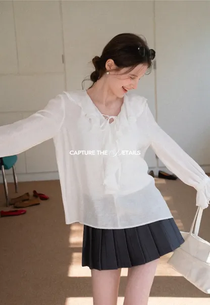Elegant Blouse with Ruffled Neckline and Flared Sleeves