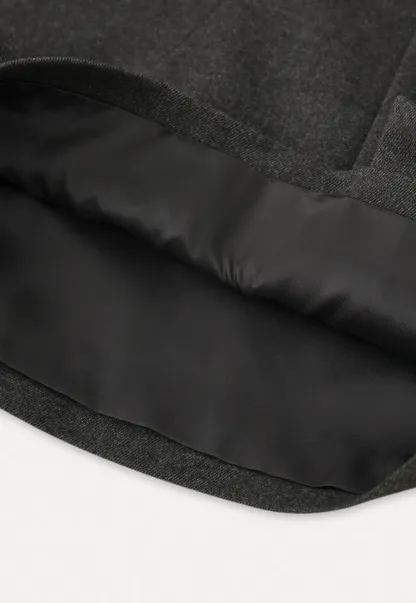 Elegant Pleated Mini Skirt with Tights and Boots Combo