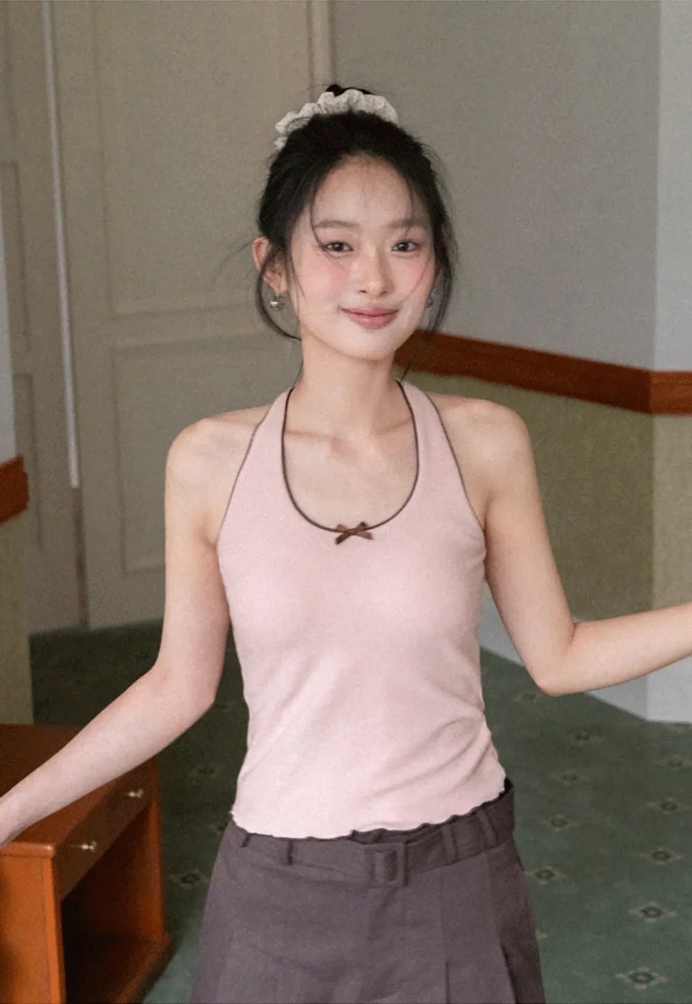 Halter neck tank top with thin straps and bow detail