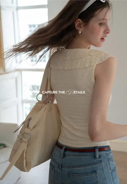 Sleeveless Top with Ruffled V Neck and Floral Detail