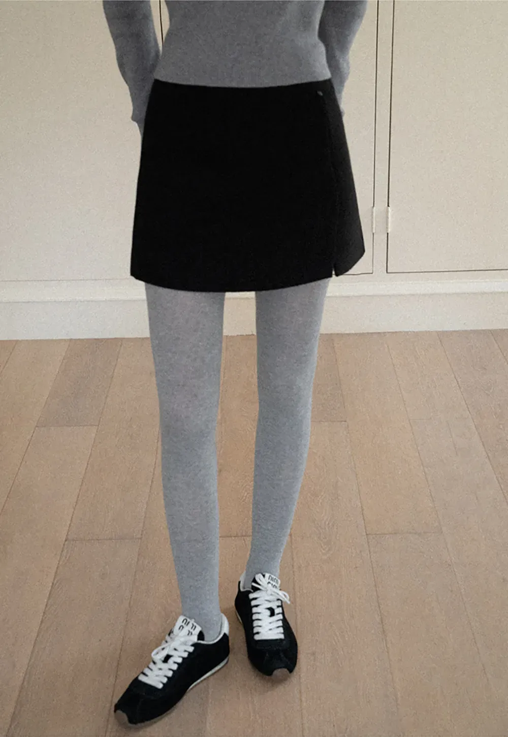 A-line mini skirt with textured fabric and central seam design