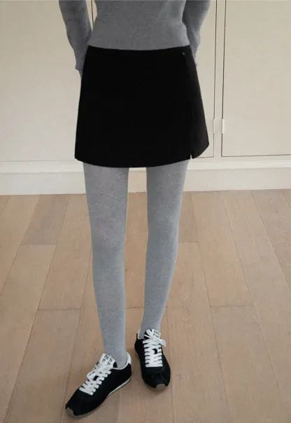 A-line mini skirt with textured fabric and central seam design