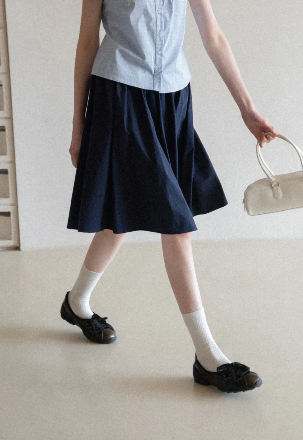 A-line pleated midi skirt with waistband