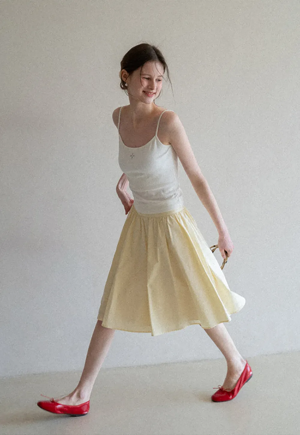 Gray tank top with small embroidered cross detail