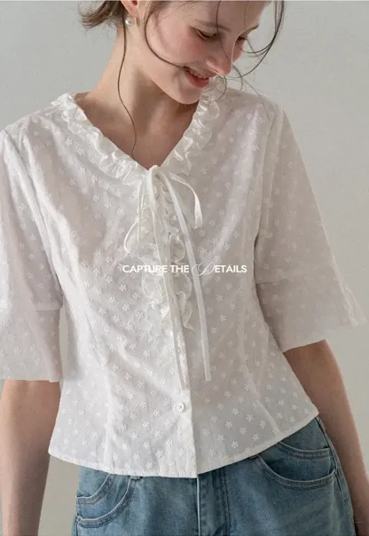 V neck blouse with lace trim and tie front