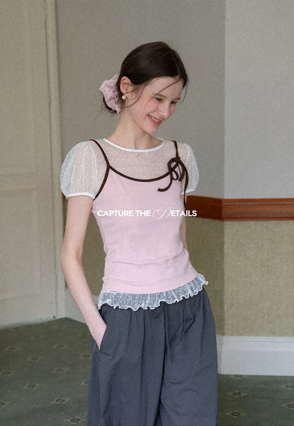 Sheer polka dot top with ruffled hem and puff sleeves