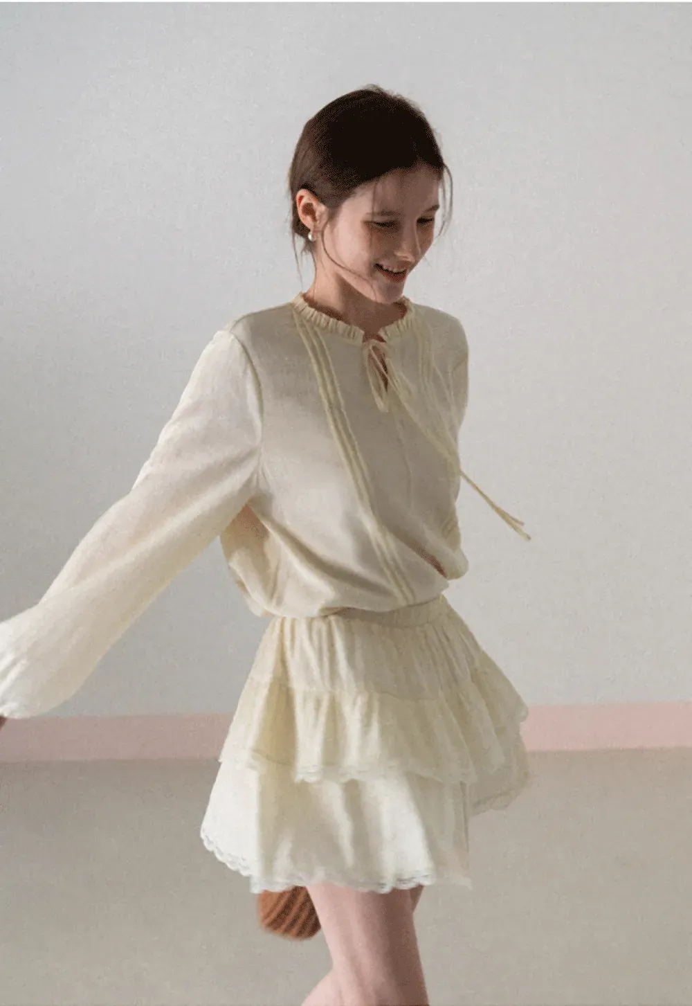 Shirt with ruffled collar and tie front layered skirt