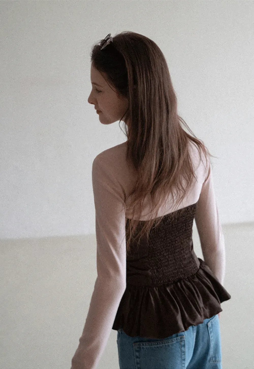 Long sleeve top with ruffled hem and layered design