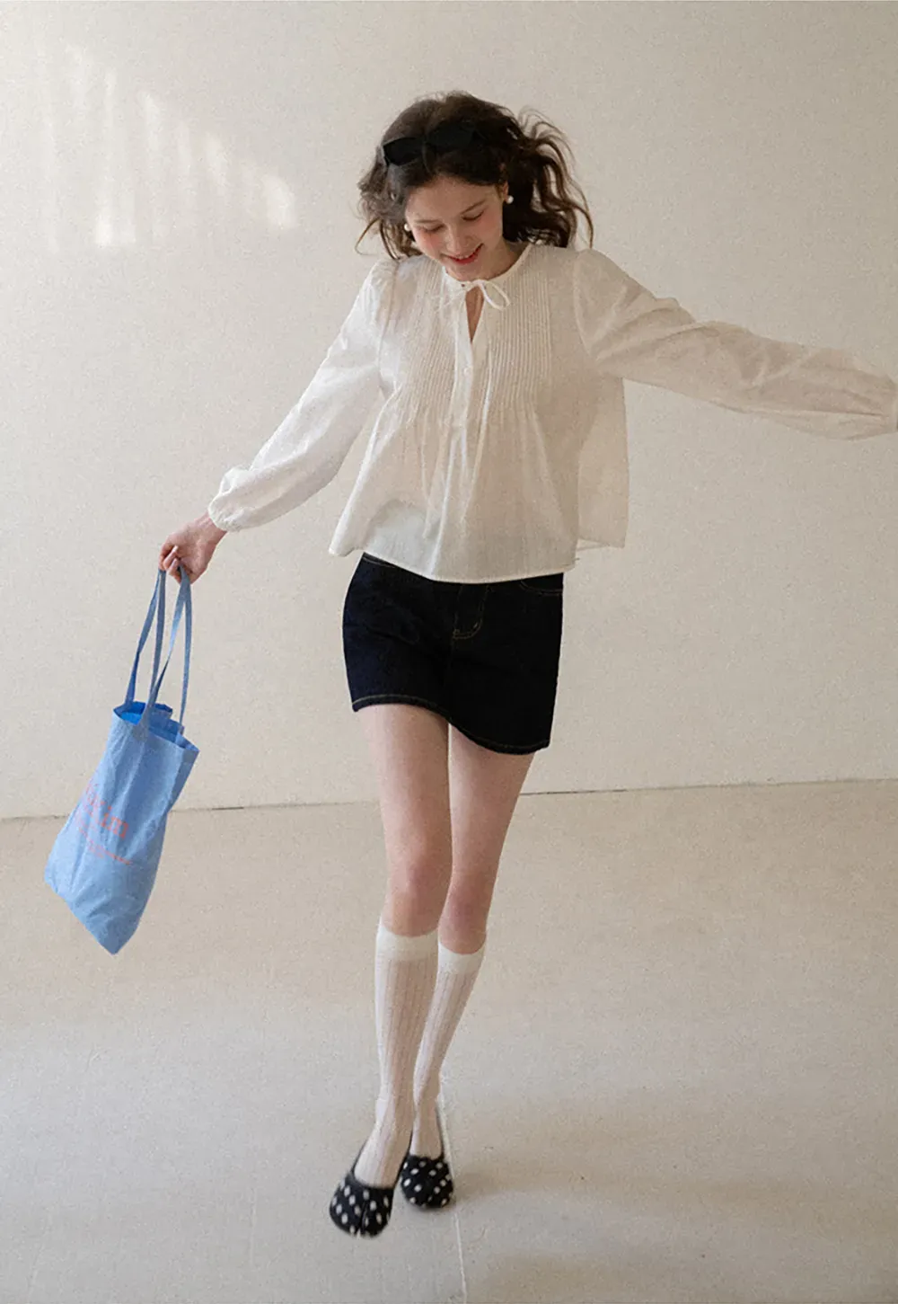 Pleated blouse with tie neck and long sleeves