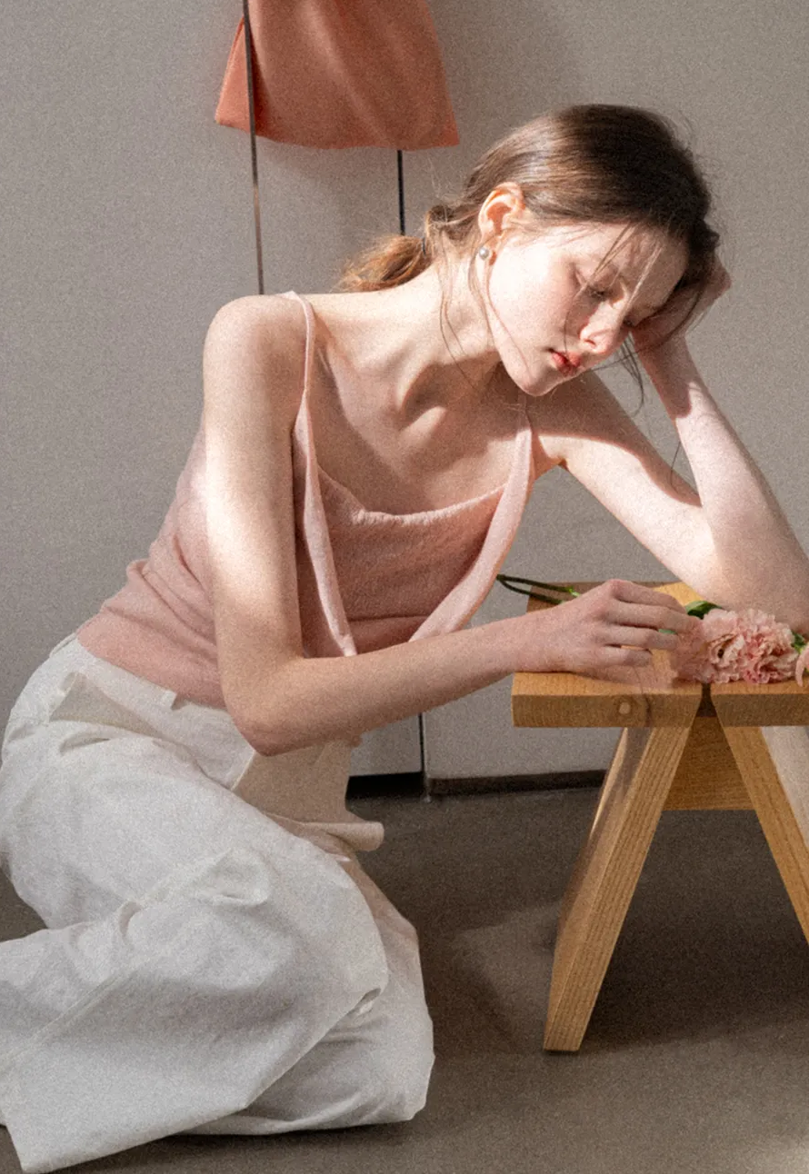 Silk-like tank top with thin straps and draped neckline