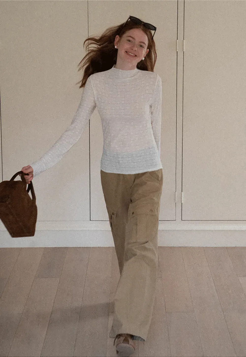 Elegant textured long sleeve top with subtle pattern design