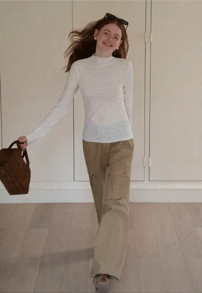 Elegant textured long sleeve top with subtle pattern design