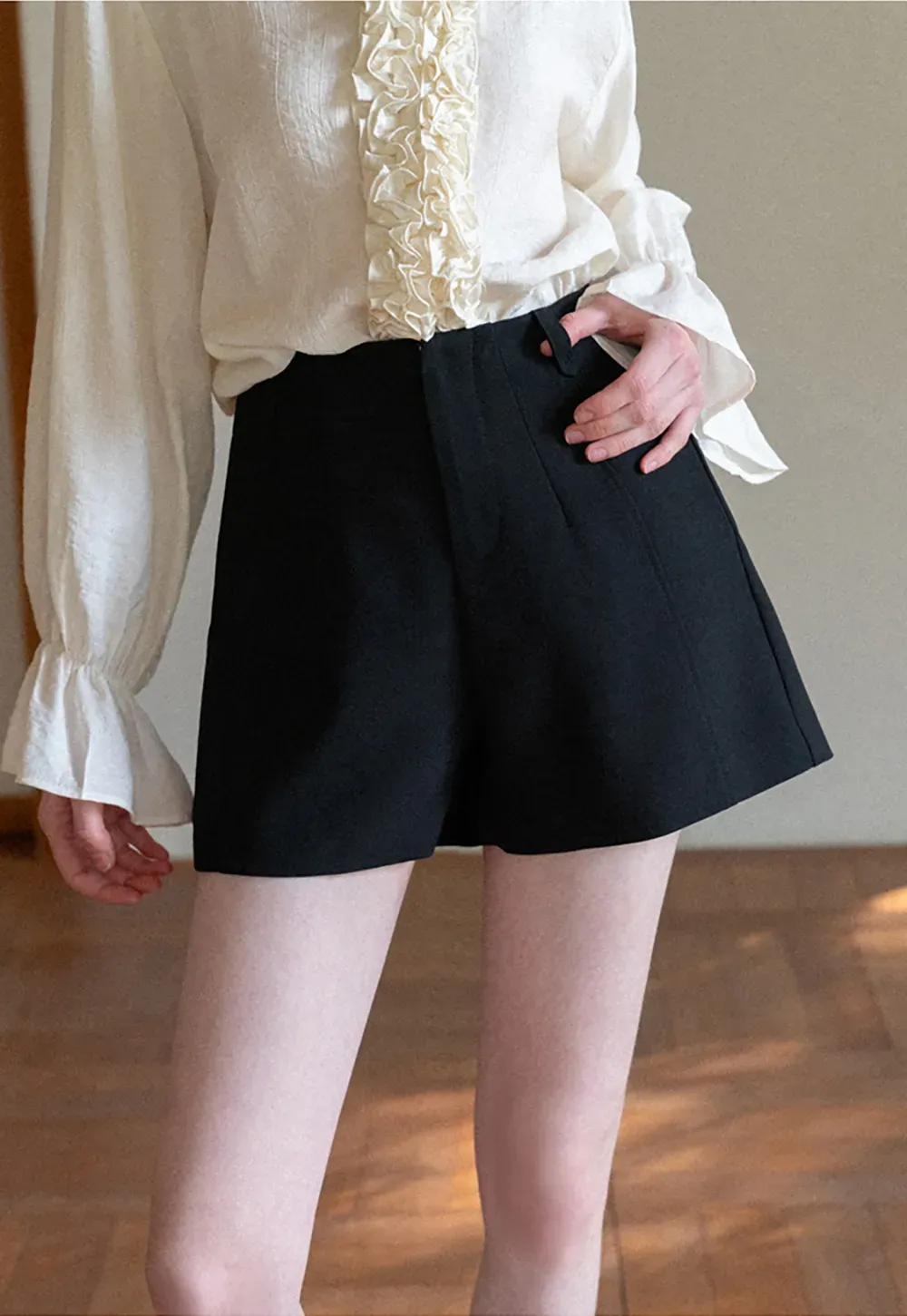 High waist pleated shorts with flared hem