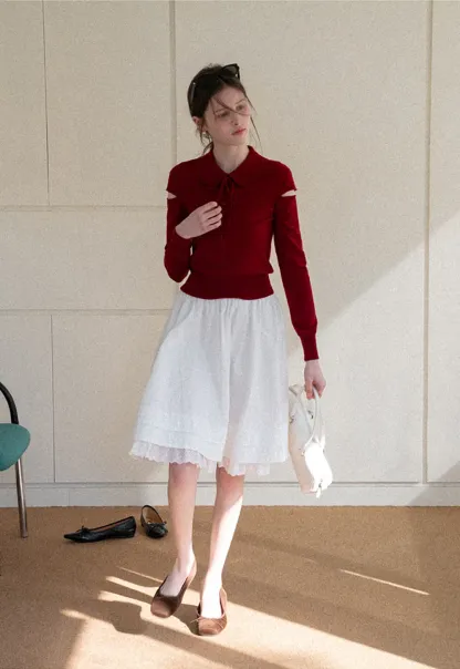 Elegant Knit Sweater with Bow Detail and Cutout Sleeves