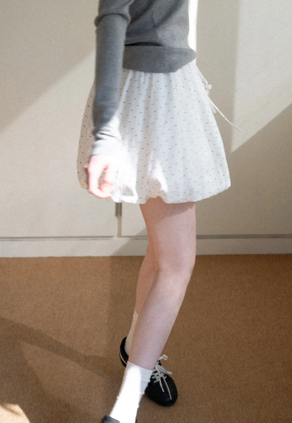 Polka dot pleated mini skirt with drawstring waist