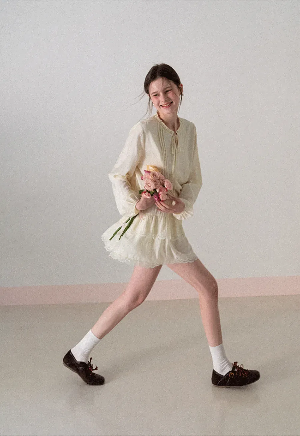 Shirt with ruffled collar and tie front layered skirt