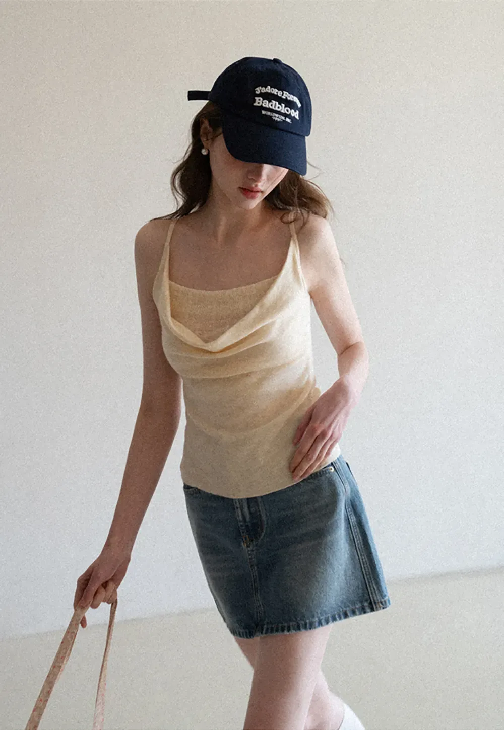 Silk-like tank top with thin straps and draped neckline