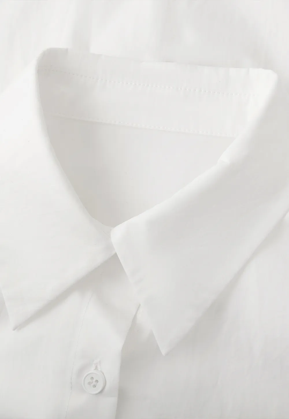 Long sleeve button front shirt with scalloped hem