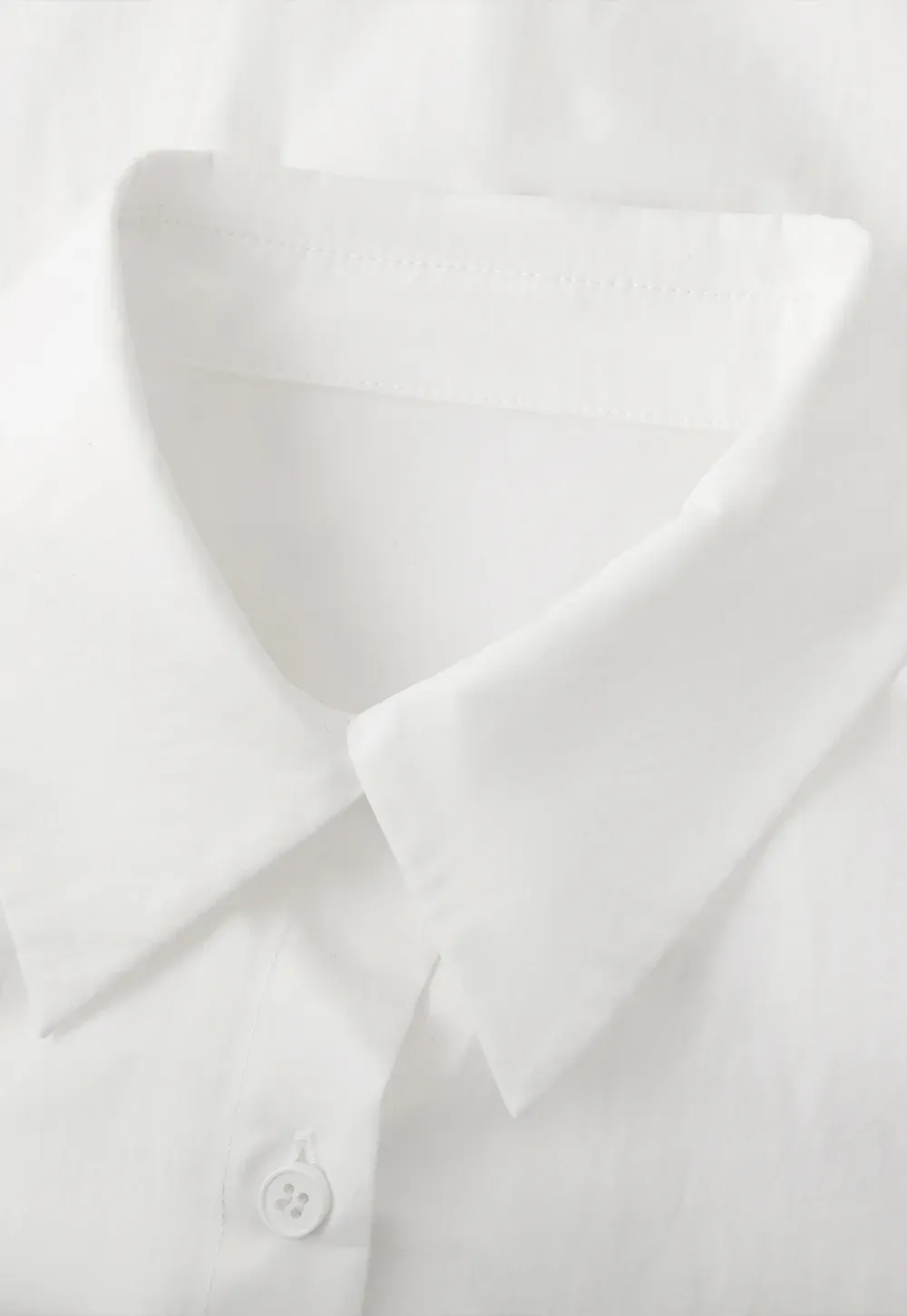 Long sleeve button front shirt with scalloped hem