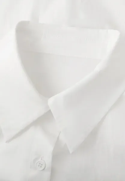 Long sleeve button front shirt with scalloped hem