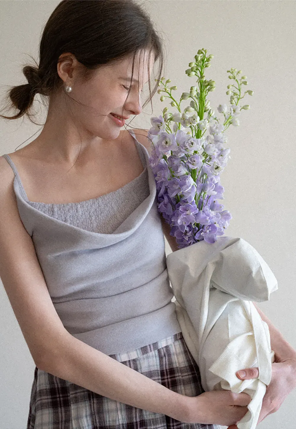 Silk-like tank top with thin straps and draped neckline