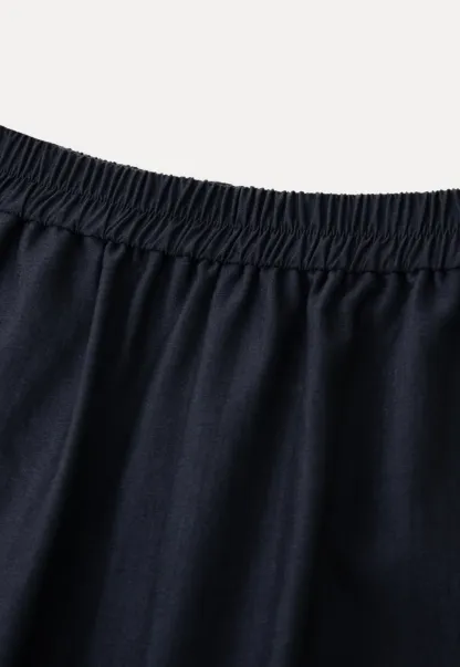 Strapless top with sheer neck tie and loose fit pants