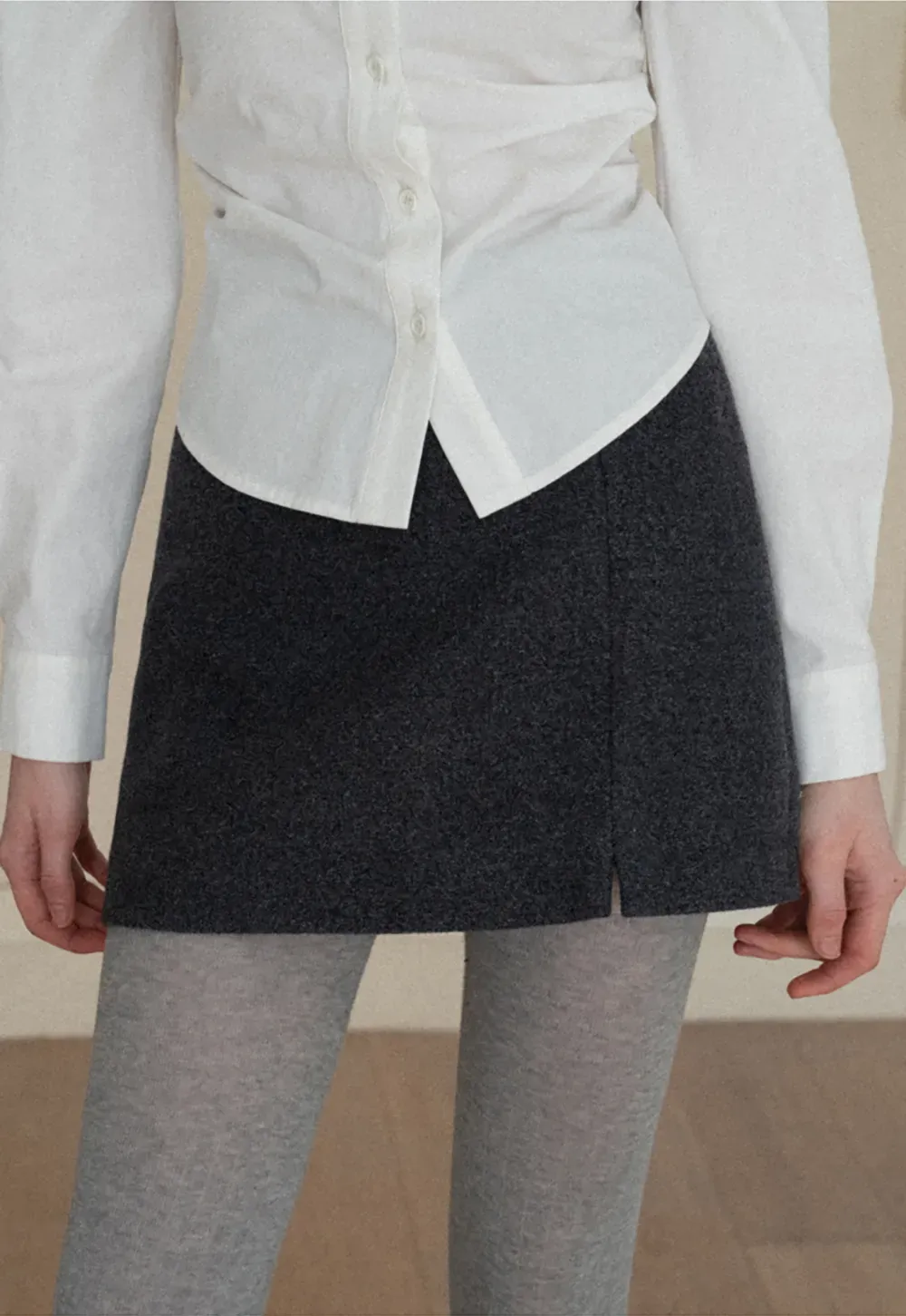 A-line mini skirt with textured fabric and central seam design