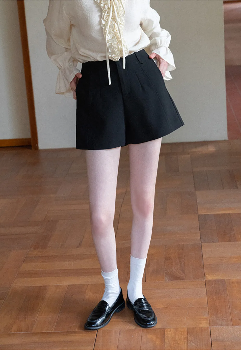 High waist pleated shorts with flared hem