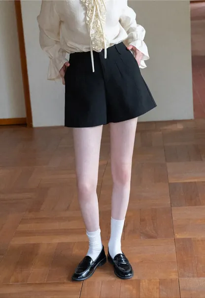 High waist pleated shorts with flared hem