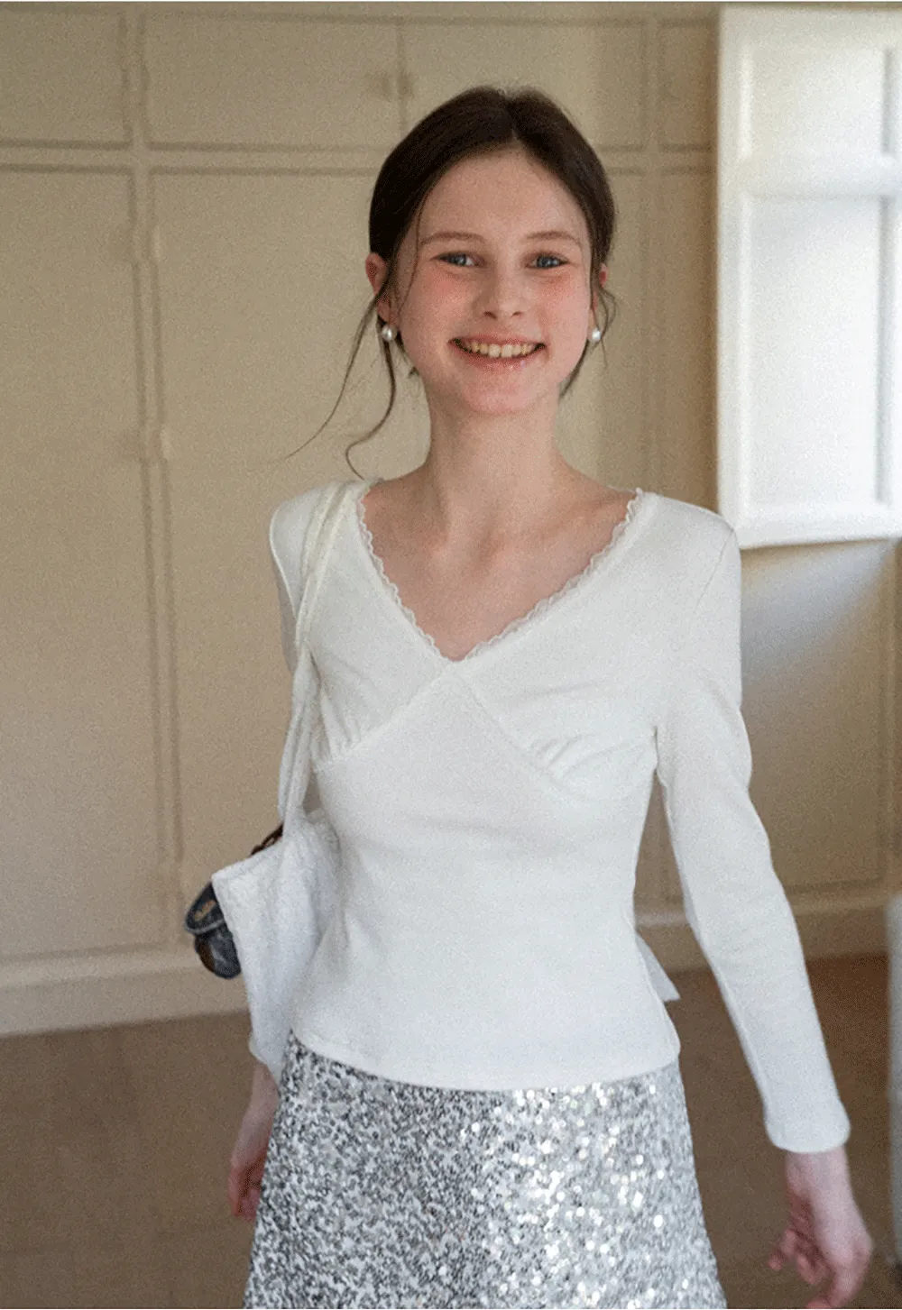 V neck long sleeve top with lace trim and fitted design