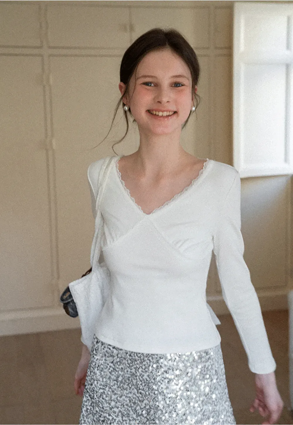 V neck long sleeve top with lace trim and fitted design