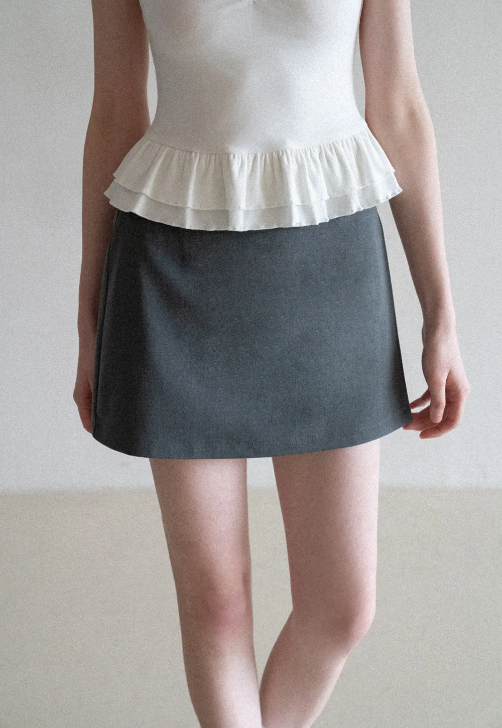 Elegant Pleated Mini Skirt with Asymmetrical Hem
