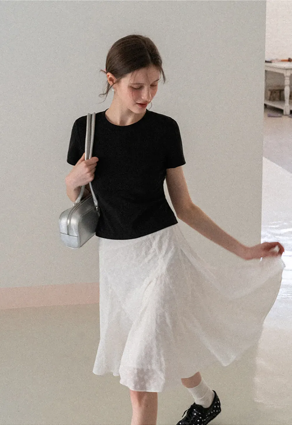 Flared pleated skirt with subtle texture