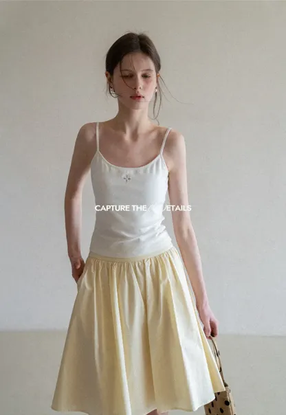 Gray tank top with small embroidered cross detail