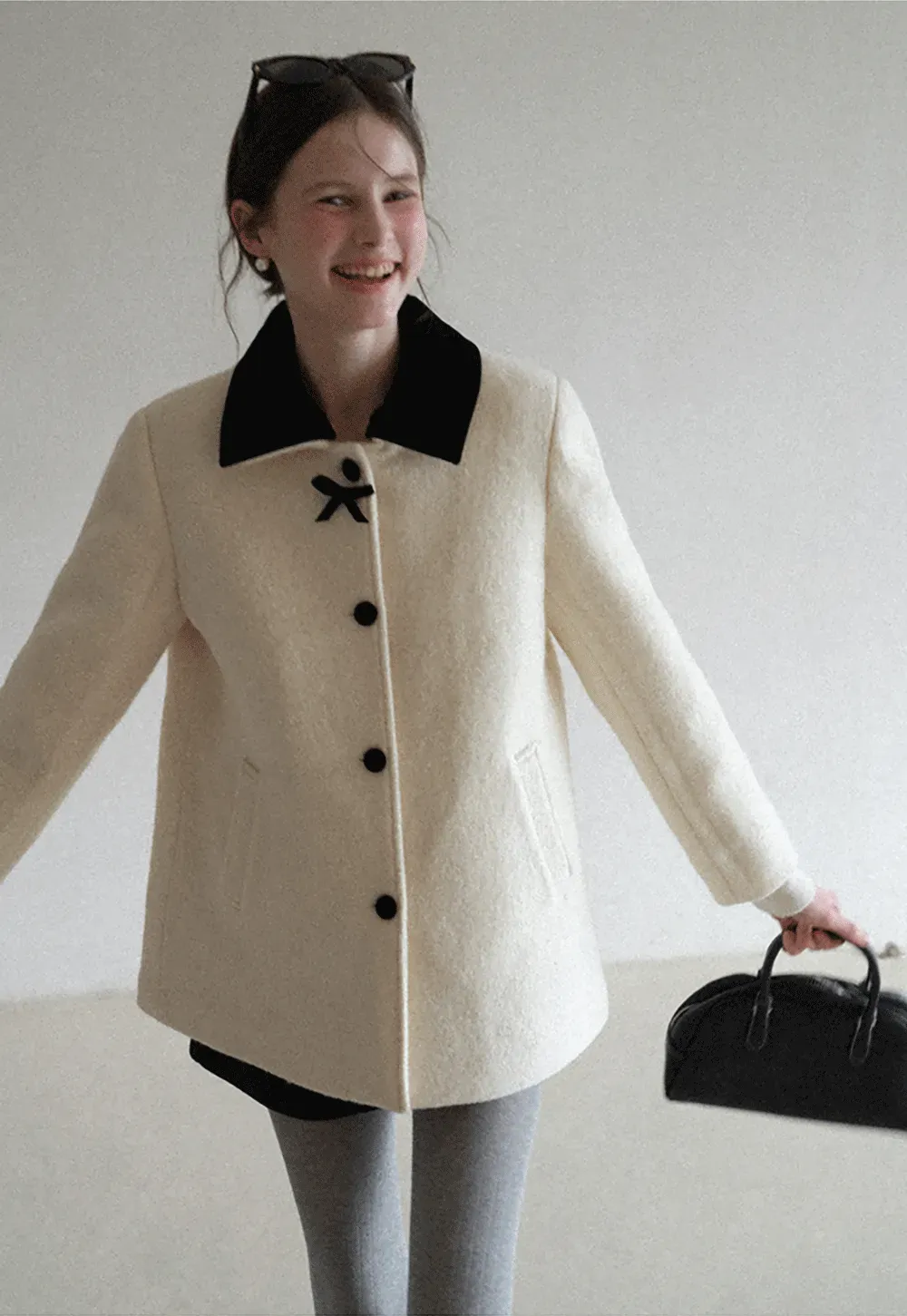 Elegant Wool Coat with Bow Detail and Contrasting Collar