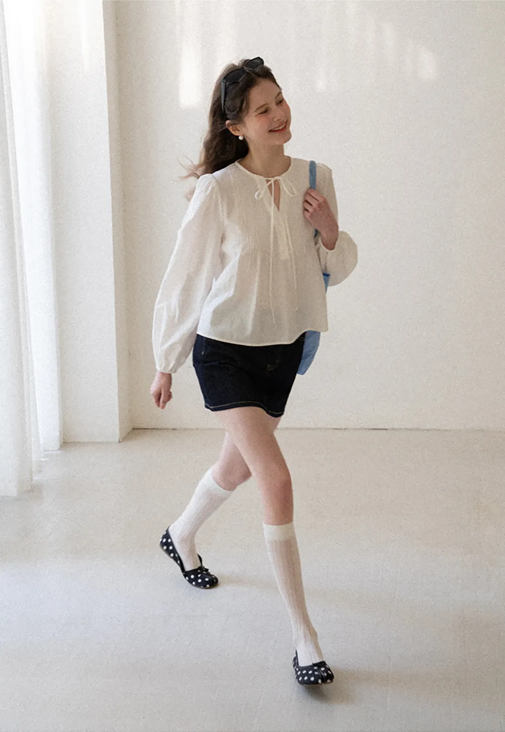 Pleated blouse with tie neck and long sleeves