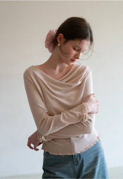 Long sleeve top with ruffled hem and cuffs