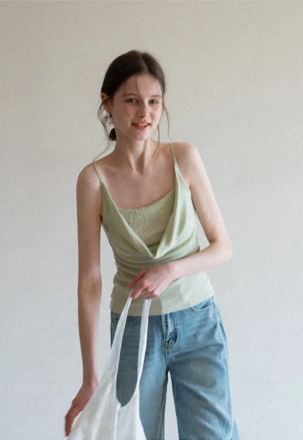 Silk-like tank top with thin straps and draped neckline
