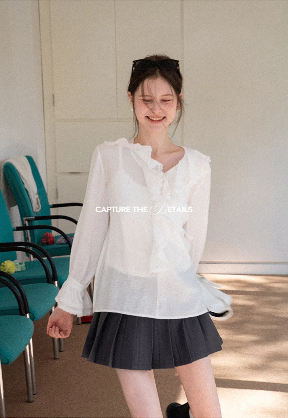 Elegant Blouse with Ruffled Neckline and Flared Sleeves