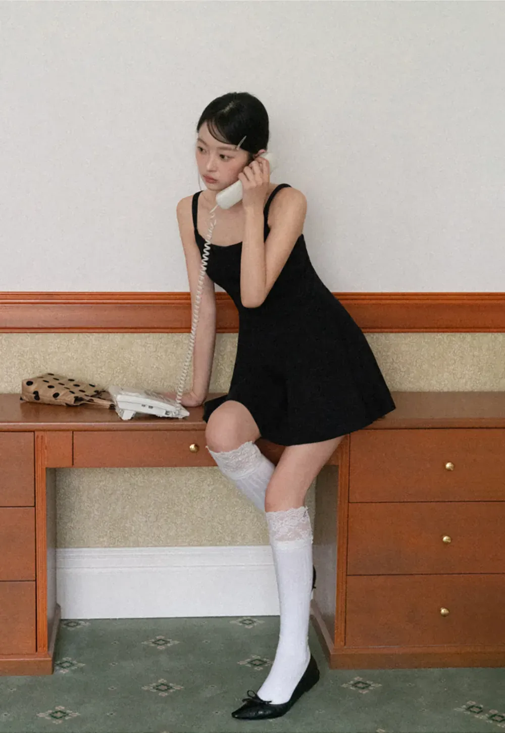 Sleeveless dress with thin straps and flared skirt