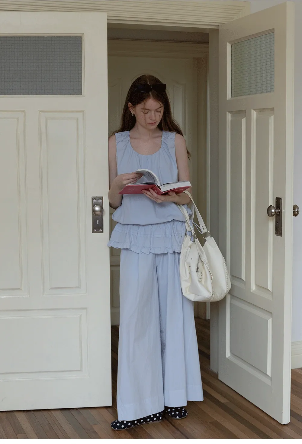 Sleeveless layered top and wide-leg pants