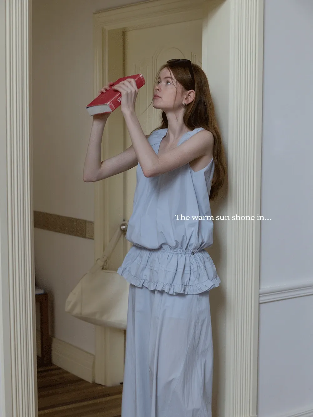 Sleeveless layered top and wide-leg pants