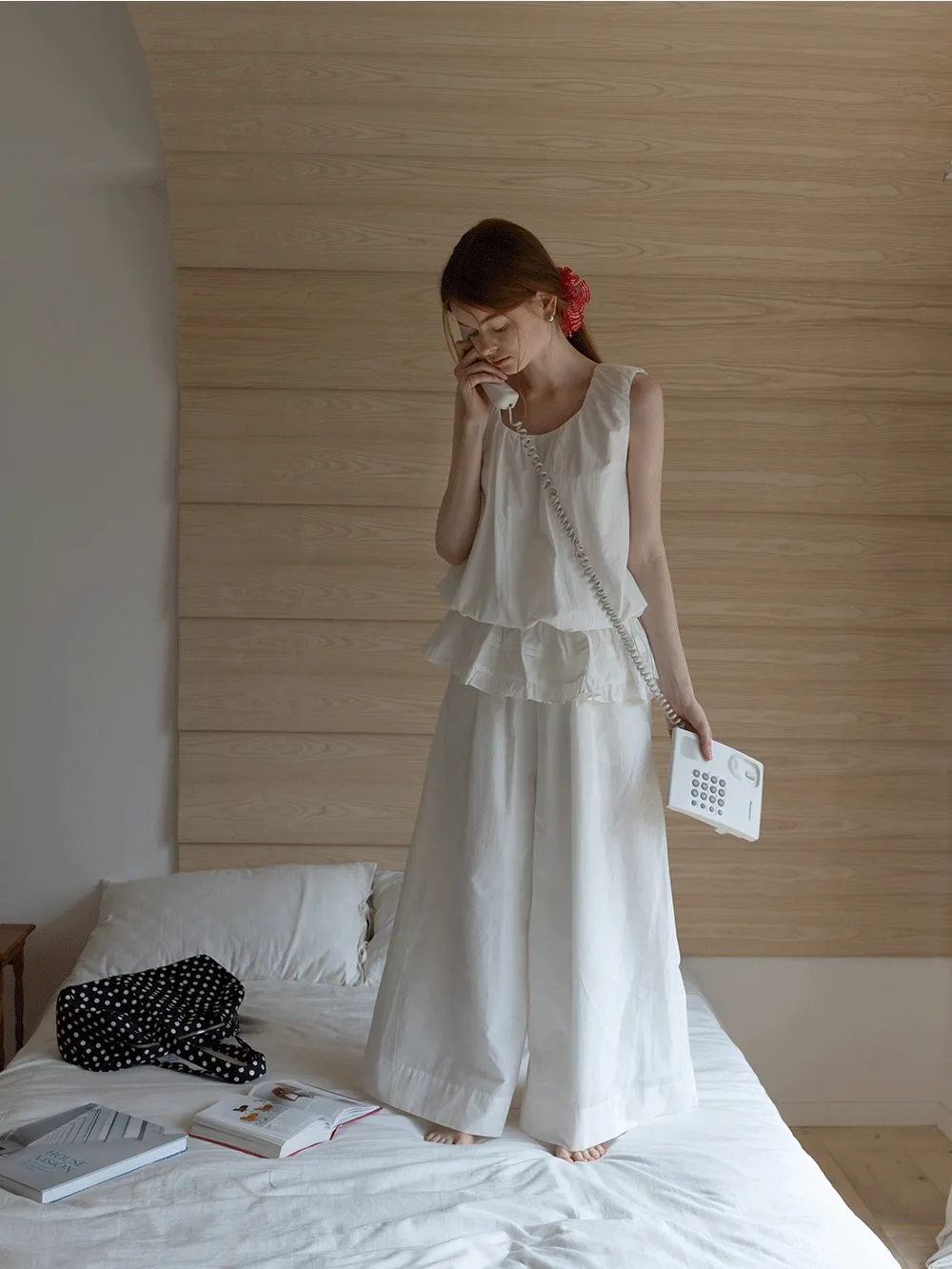 Sleeveless layered top and wide-leg pants