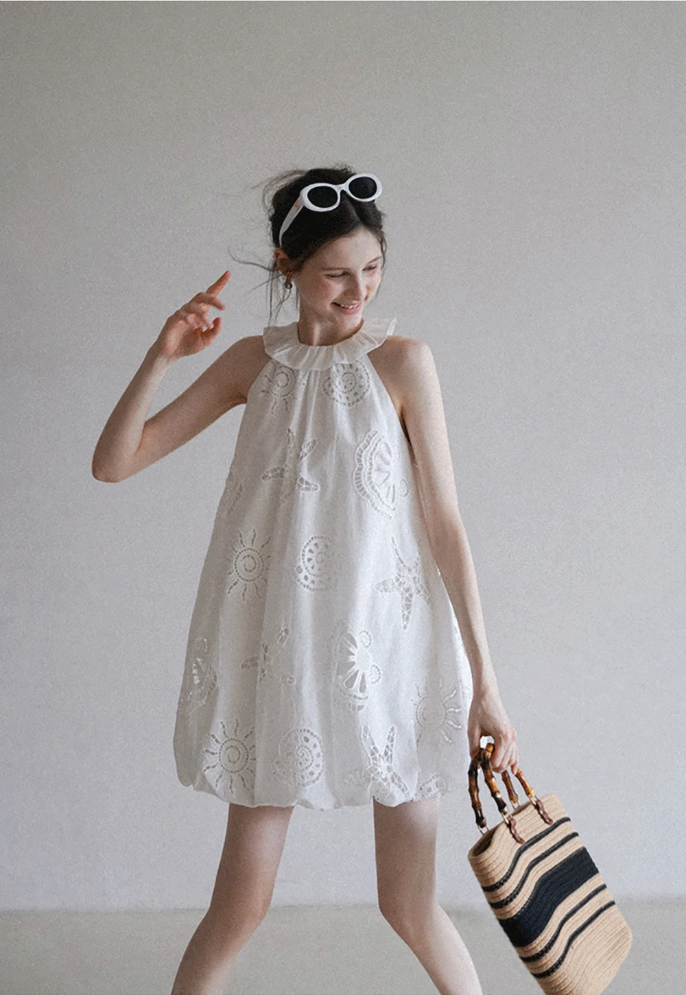 Women’s Sleeveless Eyelet Mini Dress with Ruffle Neck