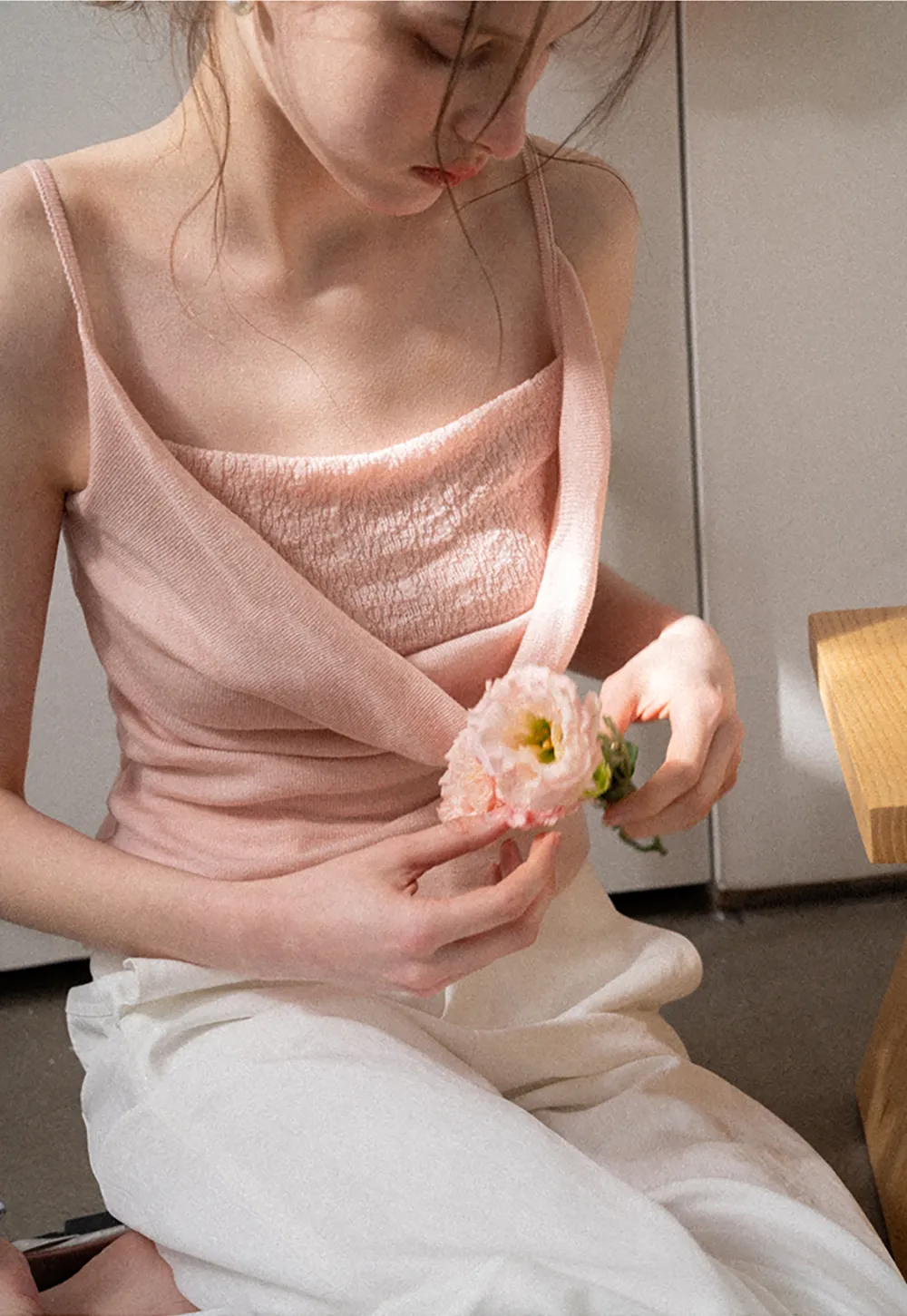 Silk-like tank top with thin straps and draped neckline